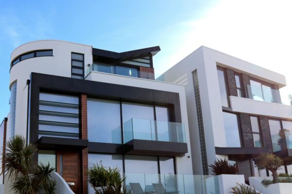 How do you calculate long-term maintenance costs before purchasing a luxury property?